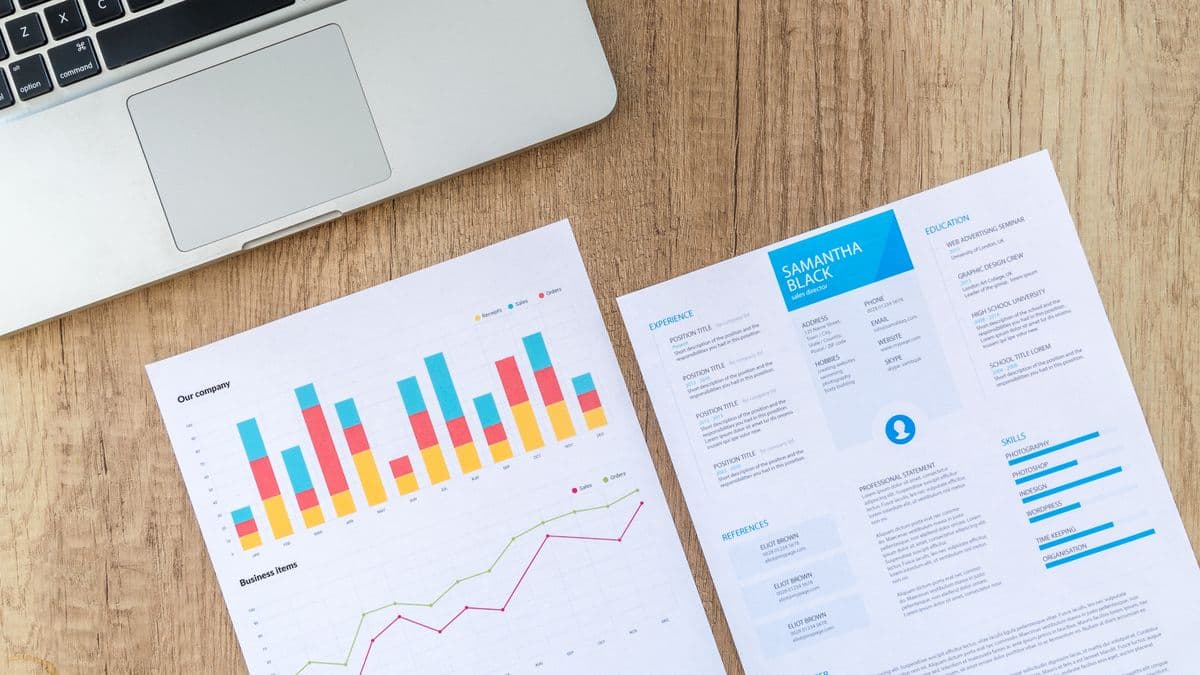 Financial charts and market data on a laptop screen